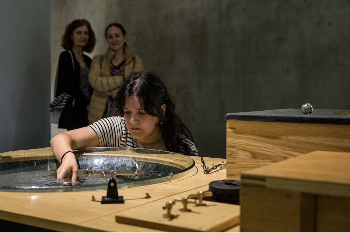 Playing a water basin instrument in Tarek Atoui’s Extended Playground