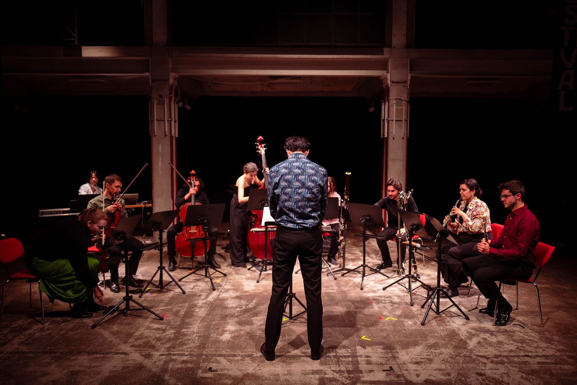 Ensemble on stage with conductor at the IEMA