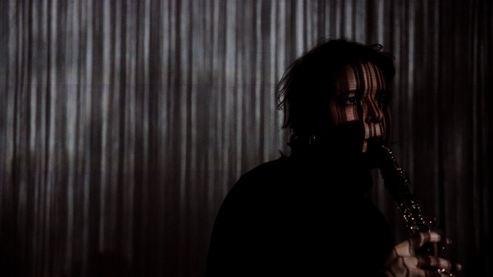 In silhouette against a curtain of blue light, I would…