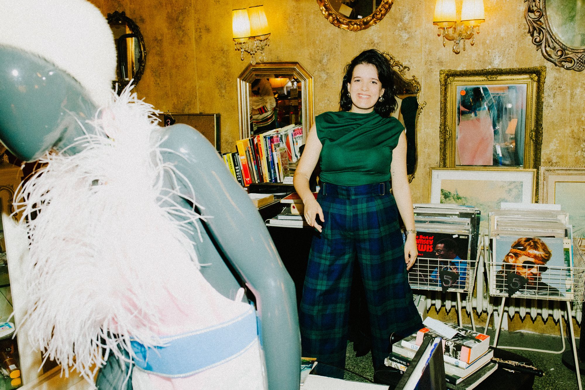 Among mirrors, lamps and record crates